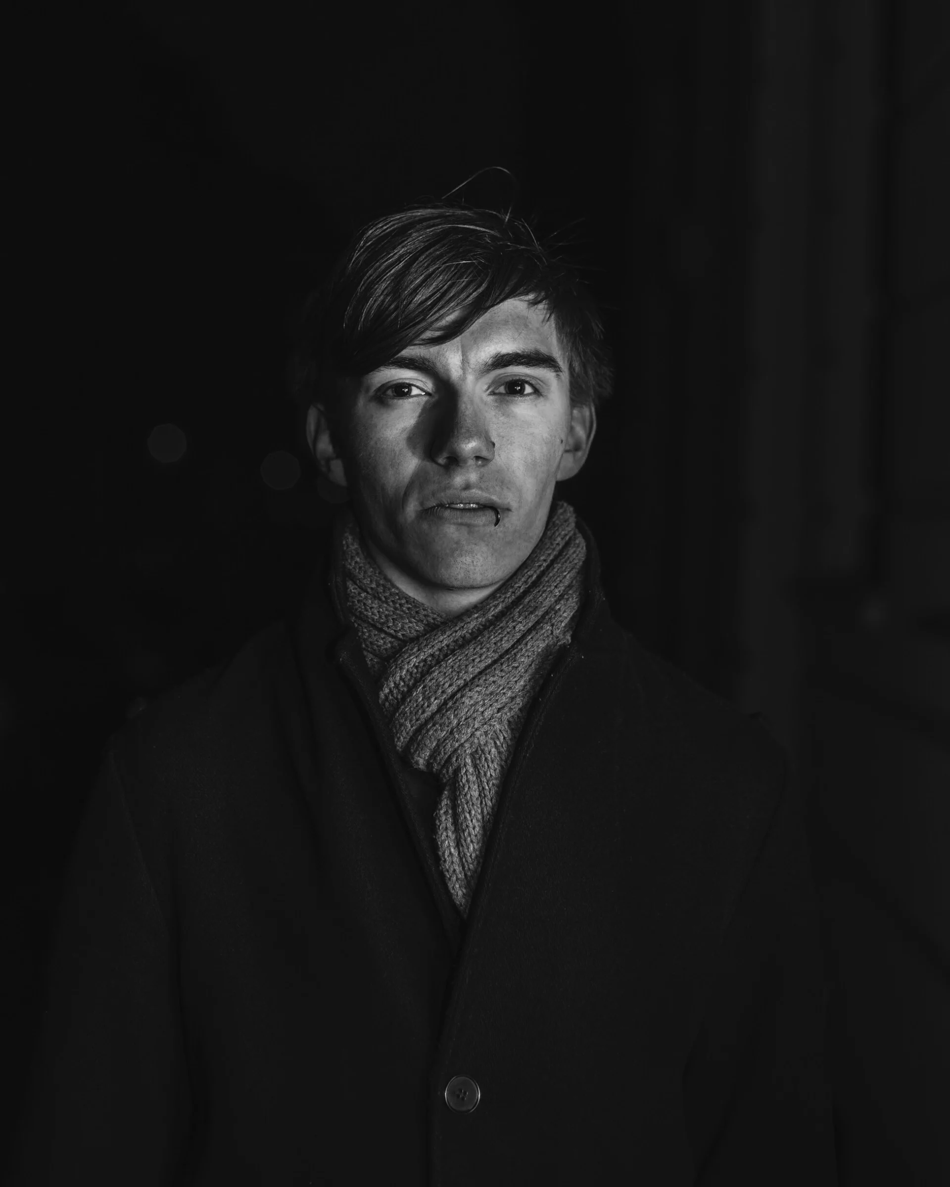 Tim facing the camera, in black and white.